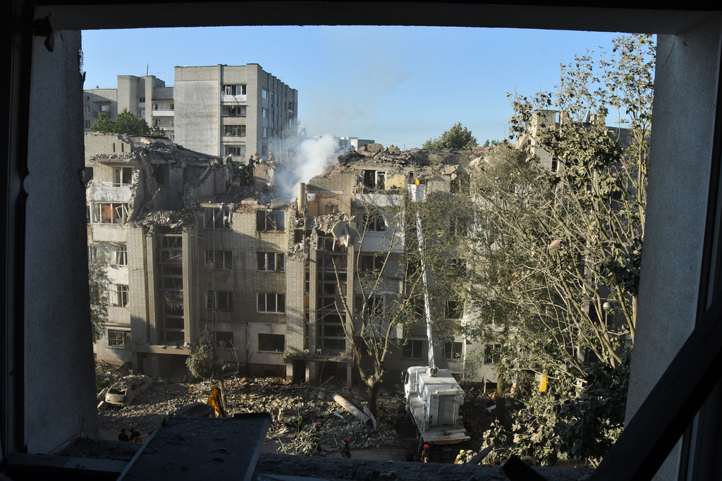 Rescuers search through the rubble of a residential building following a Russian air attack in Lviv, Ukraine, Thursday, July 30, 2026. (AP Photo/Mykola Tys)