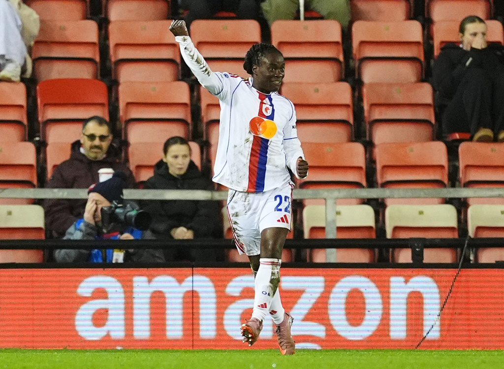 OL Lyonnes' Tabitha Chawinga celebrates scoring their side's first goal during a women's Champions League soccer match against Manchester United, Wednesday, Dec. 10, 2025, in Leigh, England. (Martin Rickett/PA via AP)