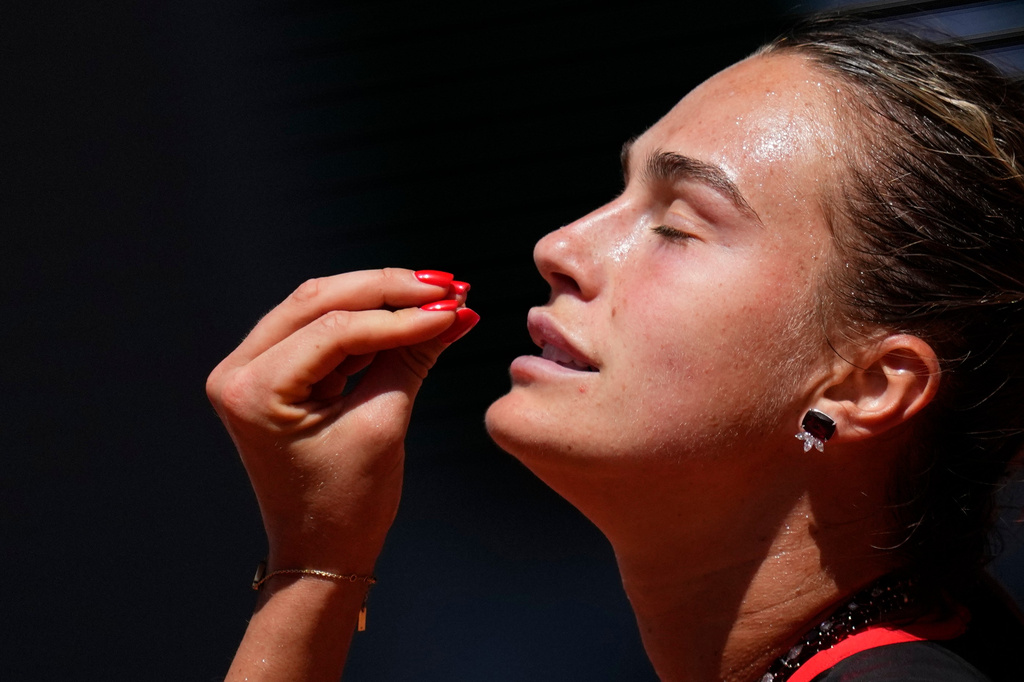 Aryna Sabalenka of Belarus reacts as she plays against Jessica Bouzas Maneiro of Spain during their first round women's singles tennis match at the French Open tennis tournament in Paris, Tuesday, May 26, 2026. (AP Photo/Christophe Ena)