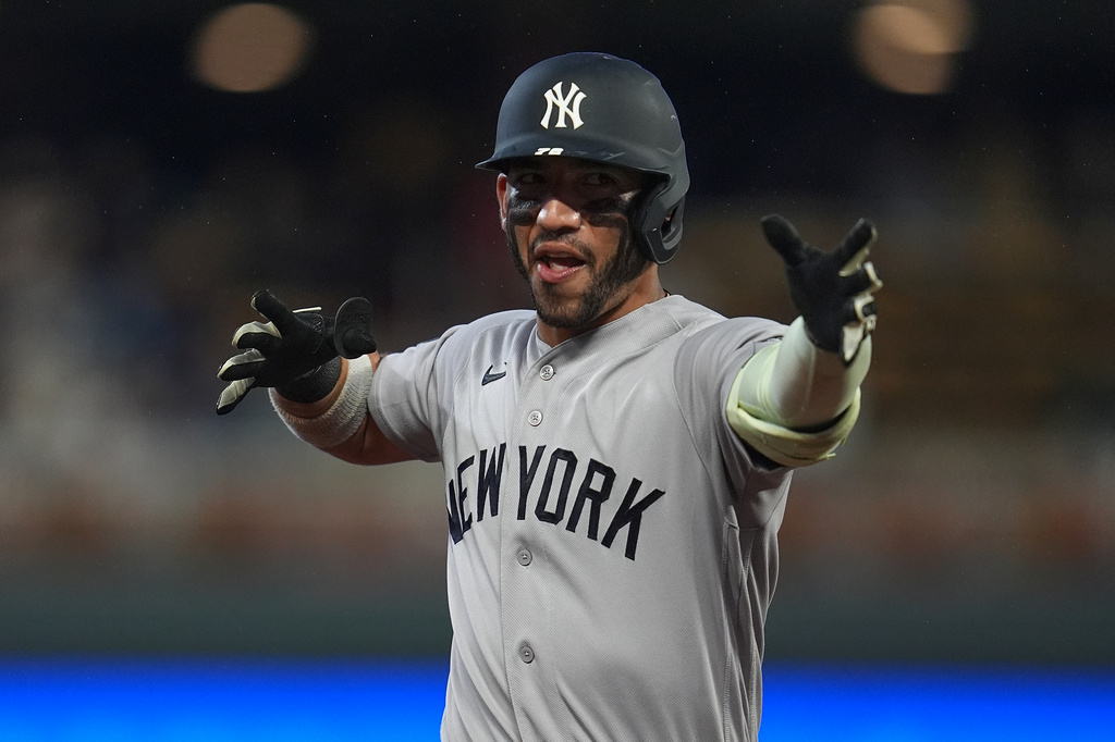New York Yankees' Jose Caballero celebrates while running the bases after hitting a solo home run during the third inning of a baseball game against the Minnesota Twins, Monday, Sept. 14, 2026, in Minneapolis. (AP Photo/Abbie Parr)