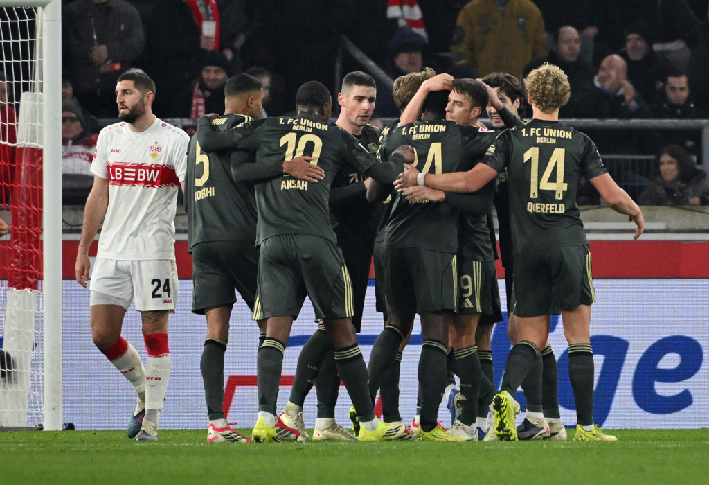 Union Berlin's players celebrate after Woo-yeong Jeong scored his side's first goal during the German Bundesliga soccer match between VfB Stuttgart and 1. FC Union Berlin, in Stuttgart, Germany, Sunday, Jan. 18, 2026. (Marijan Murat/dpa via AP)