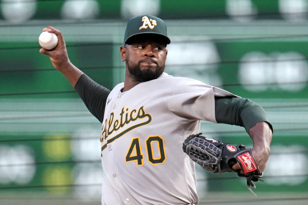 FILE - Athletics pitcher Luis Severino delivers during the first inning of a baseball game against the Pittsburgh Pirates, in Pittsburgh, Sept. 19, 2025. (AP Photo/Gene J. Puskar, File)