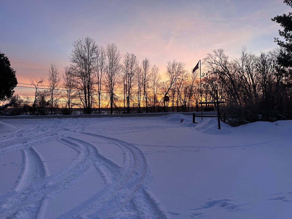 The sun rises over a winter scene in Lowville, N.Y., on Sunday, Dec. 28, 2025. (AP Photo/Cara Anna)