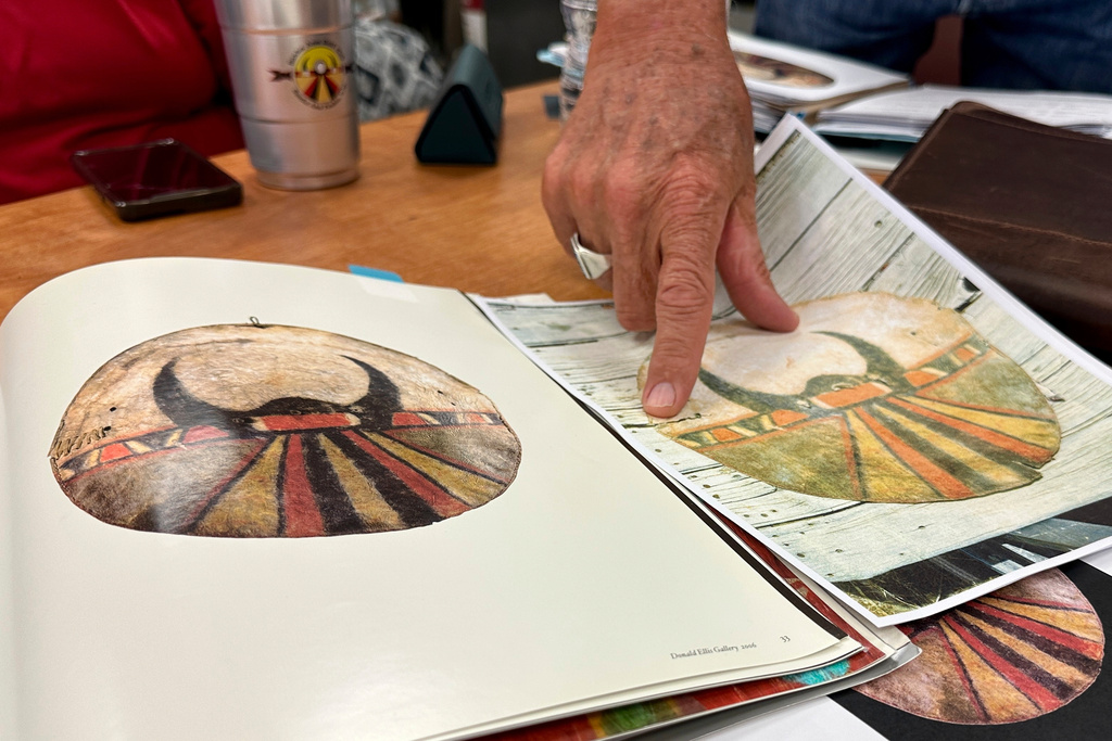 Santa Ana Pueblo Conservation Officer William Woody points to images of a war shield that was stolen from the tribe's ceremonial village decades ago, during an interview in Santa Ana Pueblo, N.M., on June 26, 2025 (AP Photo/Susan Montoya Bryan)