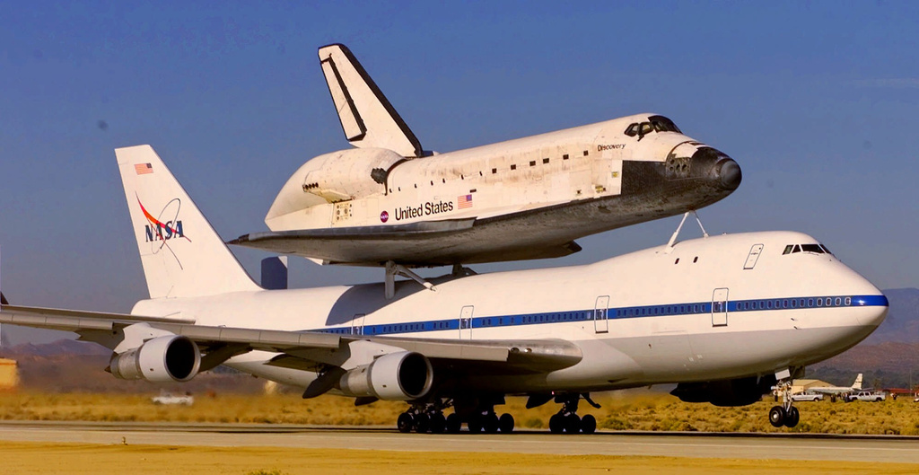 FILE -A Boeing 747 Shuttle Carrier Aircraft carrying the Space Shuttle Discovery that landed on Oct. 24, takes off from Edwards Air Force Base, bound for the Kennedy Space Center in Florida, Nov. 2, 2000, in Southern California's Mojave Desert. (AP Photo/Reed Saxon, File)