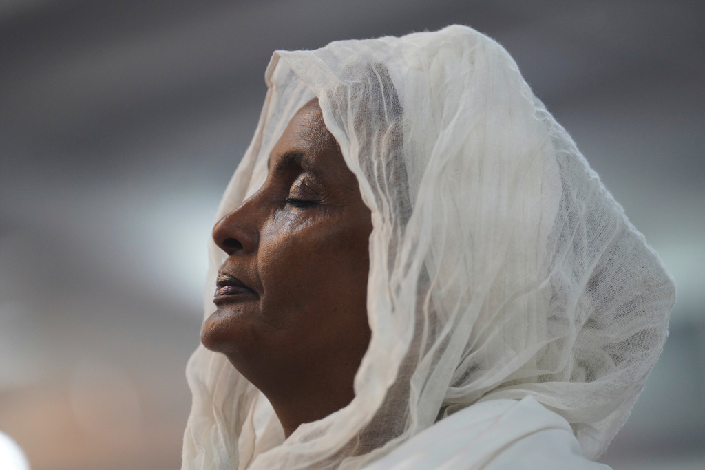 A congregant of the Re'ese Adbarat Debre Selam Kidist Mariam Church, an Ethiopian Orthodox Tewahedo church, stands during a service, in Washington, D.C., April 5, 2025. (AP Photo/Jessie Wardarski, File)