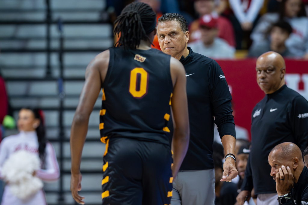 Bethune-Cookman head coach Reggie Theus reacts toward guard Jakobi Heady (0) during the first half of an NCAA college basketball game, Saturday, Nov. 29, 2025, in Bloomington, Ind. (AP Photo/Doug McSchooler)