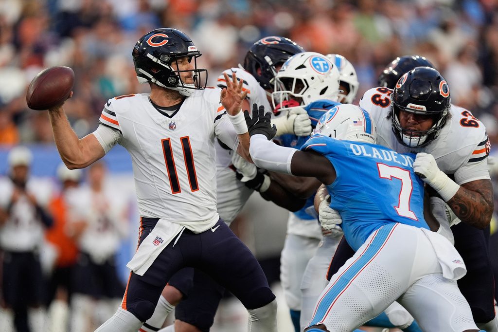 Chicago Bears quarterback Case Keenum throws under pressure against the Tennessee Titans during the second half of a preseason NFL football game, Saturday, Aug. 29, 2026, in Nashville, Tenn. (AP Photo/George Walker IV)