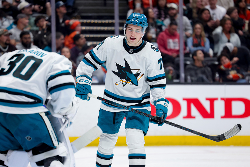 FILE - San Jose Sharks center Macklin Celebrini, right, talks with goaltender Yaroslav Askarov during the third period of an NHL hockey game against the Anaheim Ducks, April 9, 2026, in Anaheim, Calif. (AP Photo/Ryan Sun, File)