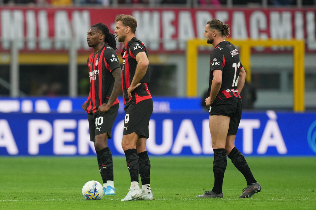 AC Milan players stand dejected after conceiding a goal during the Serie A soccer match between AC Milan and Udinese, in Milan, Italy, Saturday, April 11, 2026. (AP Photo/Antonio Calanni)