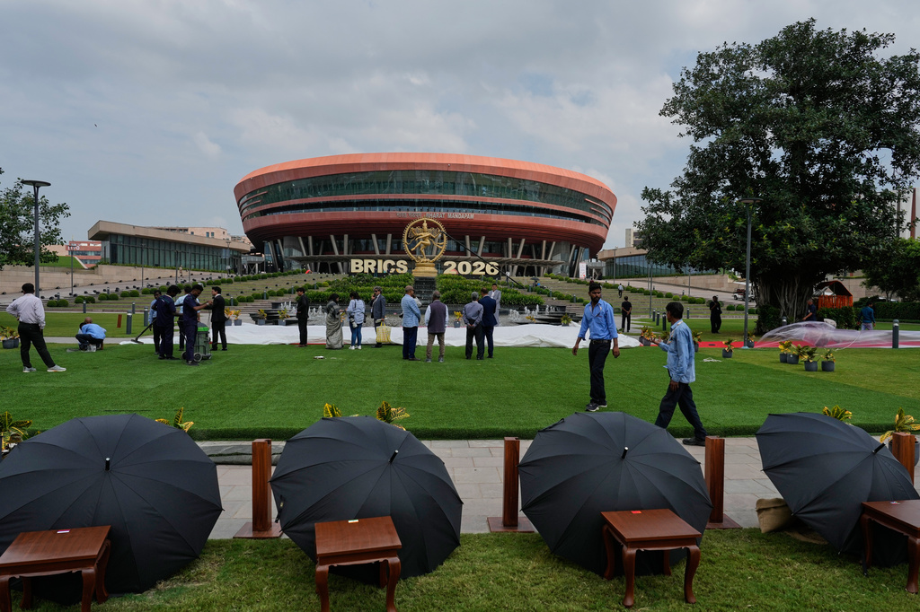 Government officials prepare a platform for the official group photograph of BRICS leaders during the summit at Bharat Mandapam in New Delhi, India, Saturday, Sept. 12, 2026. (AP Photo/Manish Swarup)