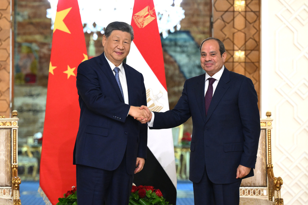 In this photo released by Xinhua News Agency, visiting Chinese President Xi Jinping, left, shakes hands with Egyptian President Abdel-Fattah el-Sissi prior to their meeting in Cairo, Egypt, Wednesday, Sept. 2, 2026. (Xie Huanchi/Xinhua via AP)