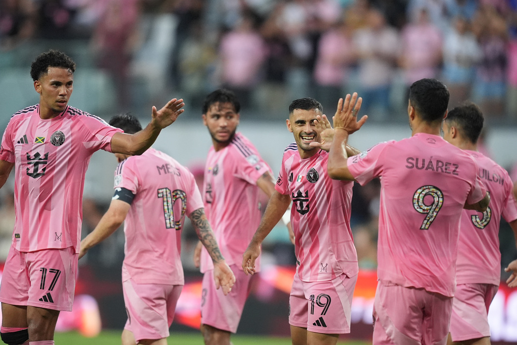 Inter Miami forward Germán Berterame (19) celebrates with teammates after scoring his side's third goal during the first half of an MLS soccer match against Philadelphia Union, Sunday, May 24, 2026, in Miami. (AP Photo/Rebecca Blackwell)