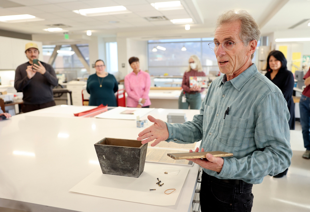 Randy Silverman, University of Utah Marriott Library head of preservation, talks about the uniqueness of a heavy metal box used for the Japanese Church of Christ's 100-year-old time capsule at the University of Utah Marriott Library Preservation Department in Salt Lake City, Monday, Oct. 20, 2025. (Kristin Murphy/The Deseret News via AP)