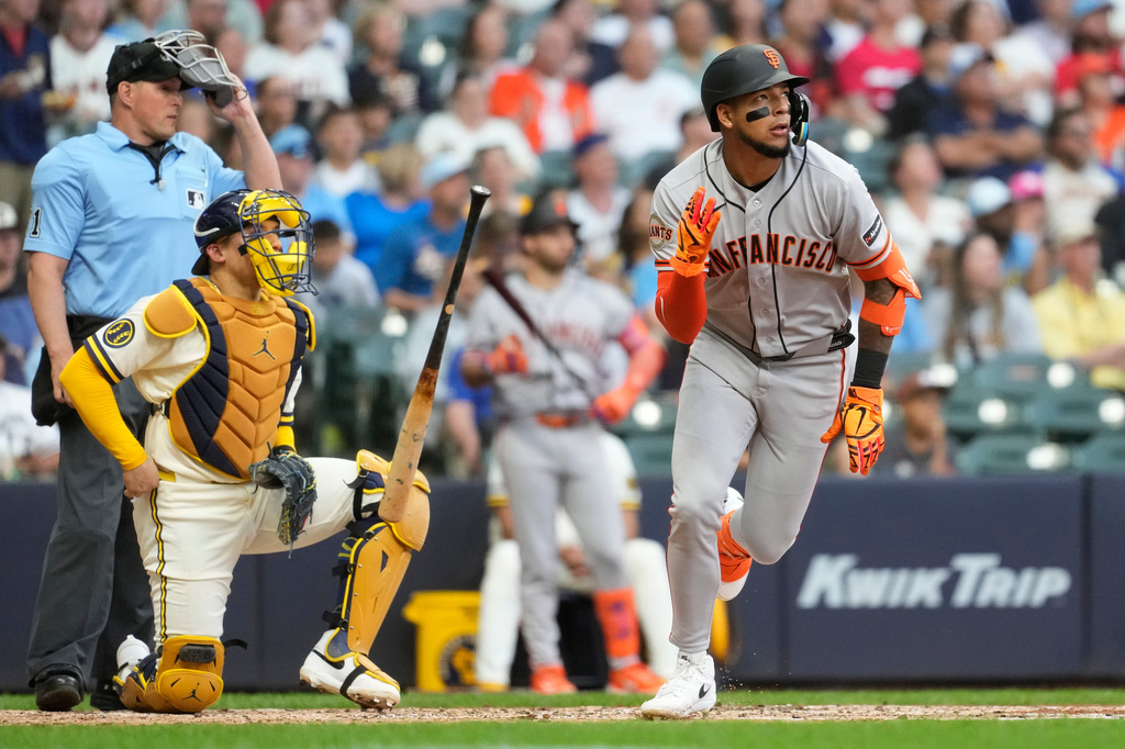 San Francisco Giants' Victor Bericoto tosses his bat after hitting a solo home run during the fifth inning of a baseball game against the Milwaukee Brewers, Wednesday, June 3, 2026, in Milwaukee. (AP Photo/Aaron Gash)