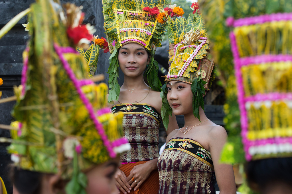 Dancers wait to perform the sacred Rejang dance during Kuningan holiday, which marks the end of the 10-day Galungan festival celebrating the victory of good over evil, in Karangasem, Bali, Indonesia, Saturday, June 27, 2026. (AP Photo/Firdia Lisnawati)