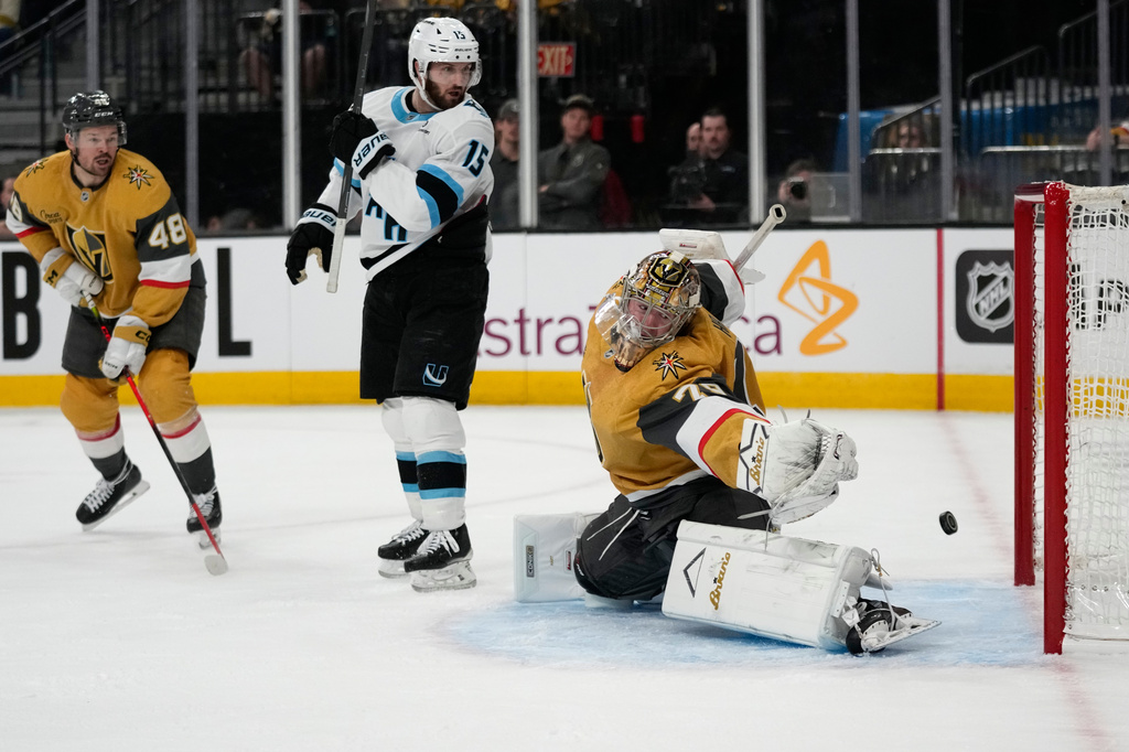 Vegas Golden Knights goaltender Carter Hart (79) is scored on by Utah Mammoth center Logan Cooley (92) during the first period in Game 1 of a first-round NHL hockey Stanley Cup playoff series Sunday, April 19, 2026, in Las Vegas. (AP Photo/John Locher)