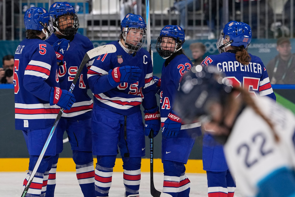 United States' Hilary Knight celebrates with teammates after scoring her sides fourth goal during a preliminary round match of women's ice hockey between the United States and Finland at the 2026 Winter Olympics, in Milan, Italy, Saturday, Feb. 7, 2026. (AP Photo/Petr David Josek)