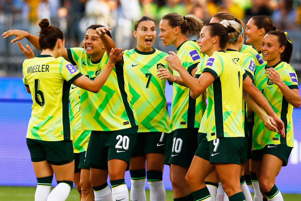 Australia's Sam Kerr is congratulated by teammate Clare Wheeler, left, after scoring their first goal during the Women's Asia Cup soccer match between Australia and the Philippines in Perth, Australia, Sunday, March 1, 2026. (AP Photo/Gary Day)