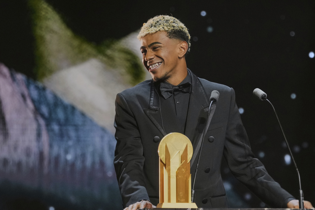 Barcelona's Spanish player Lamine Yamal receives the Kopa Trophy during the 69th Ballon d'Or (Golden Ball) award ceremony at Theatre du Chatelet in Paris, Monday, Sept. 22, 2025. (AP Photo/Thibault Camus)