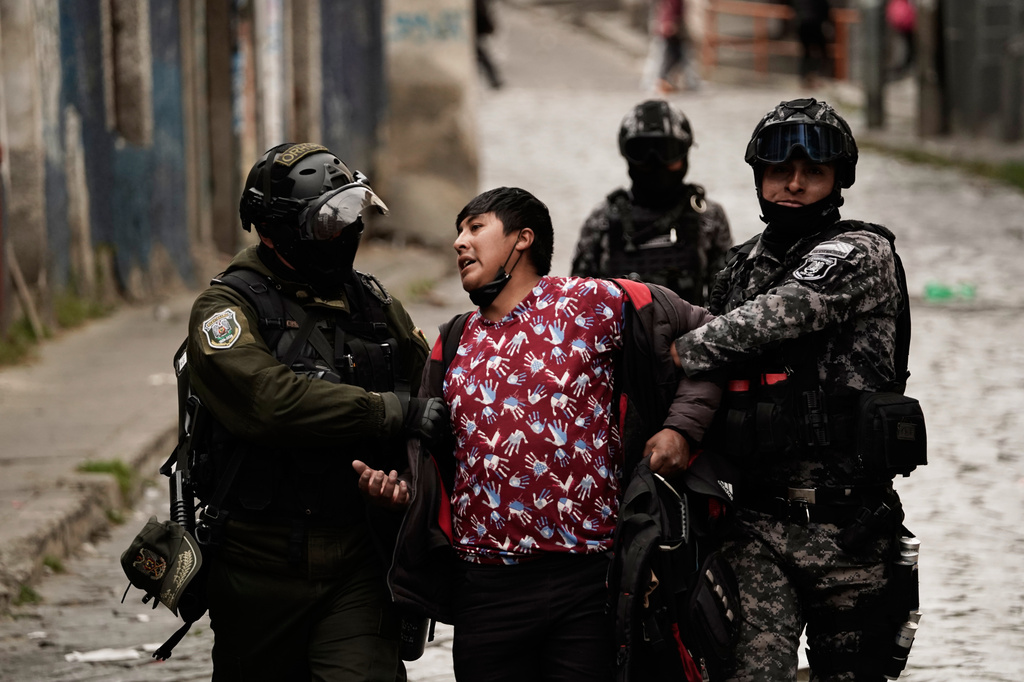 Police officers detain a demonstrator during an anti-government protest in La Paz, Bolivia, Monday, May 18, 2026. (AP Photo/Freddy Barragan)