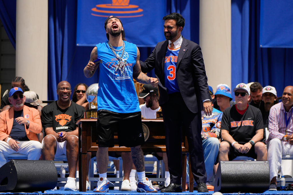 New York Knicks guard Jose Alvarado, left, celebrates with Mayor Zohran Mamdani during the New York Knicks' NBA championship parade Thursday, June 18, 2026, in New York. (AP Photo/Yuki Iwamura)