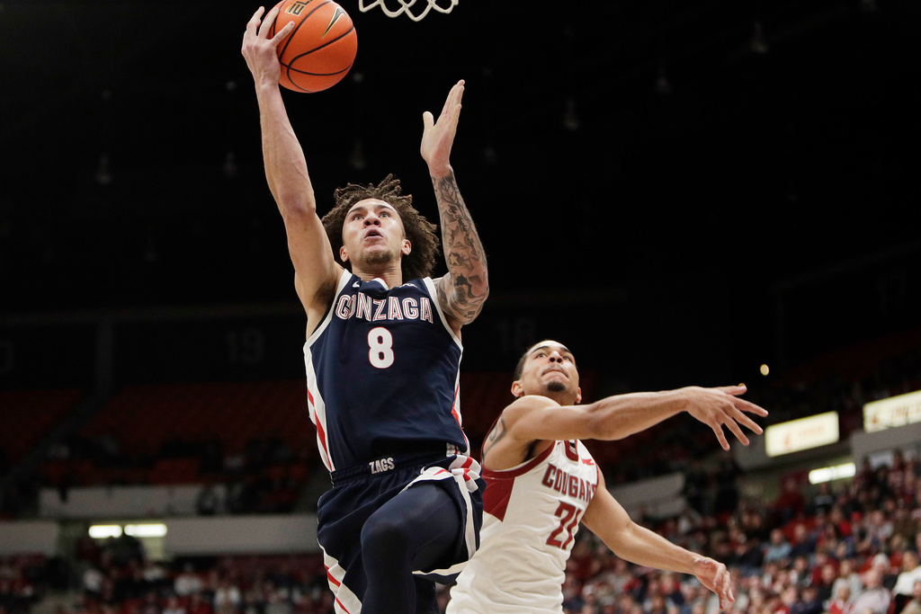 Gonzaga guard Jalen Warley (8) shoots next to Washington State guard Ace Glass, right, during the first half of an NCAA college basketball game, Thursday, Jan. 15, 2026, in Pullman, Wash. (AP Photo/Young Kwak)