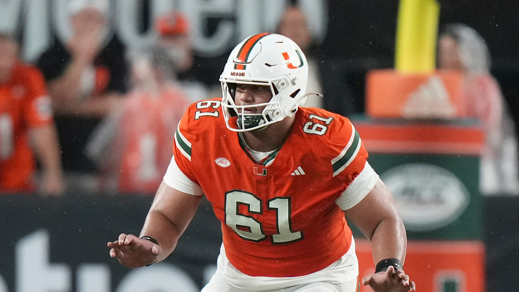 FILE - Miami offensive lineman Francis Mauigoa (61) blocks during an NCAA football game on Sunday, Aug. 31, 2025, in Miami. (AP Photo/Peter Joneleit, File)