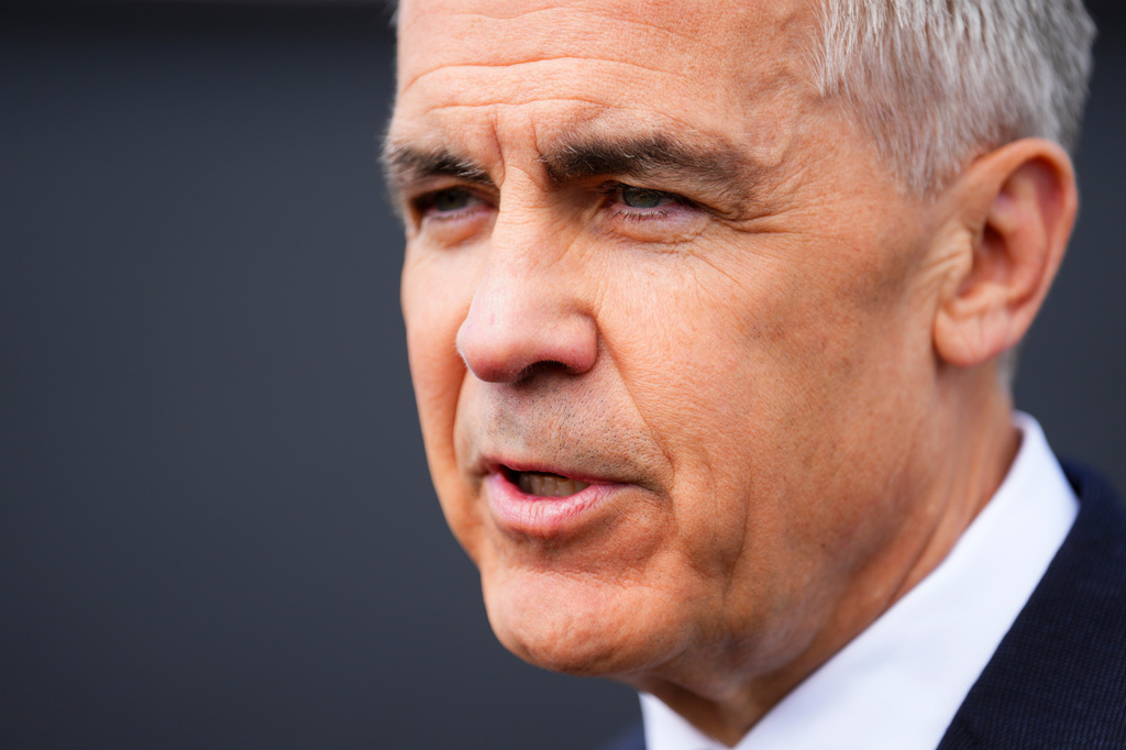 Prime Minister Mark Carney talks to reporters as he takes part in an event at a new housing development in Orleans, Ont., on Monday, May 25, 2026. (Sean Kilpatrick /The Canadian Press via AP)