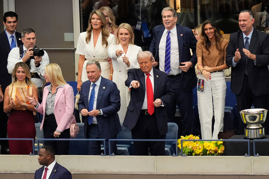 FILE - President Donald Trump, center, attends the men's singles final at the U.S. Open tennis tournament, Sept. 7, 2025, in New York. (AP Photo/Manuel Balce Ceneta, File)
