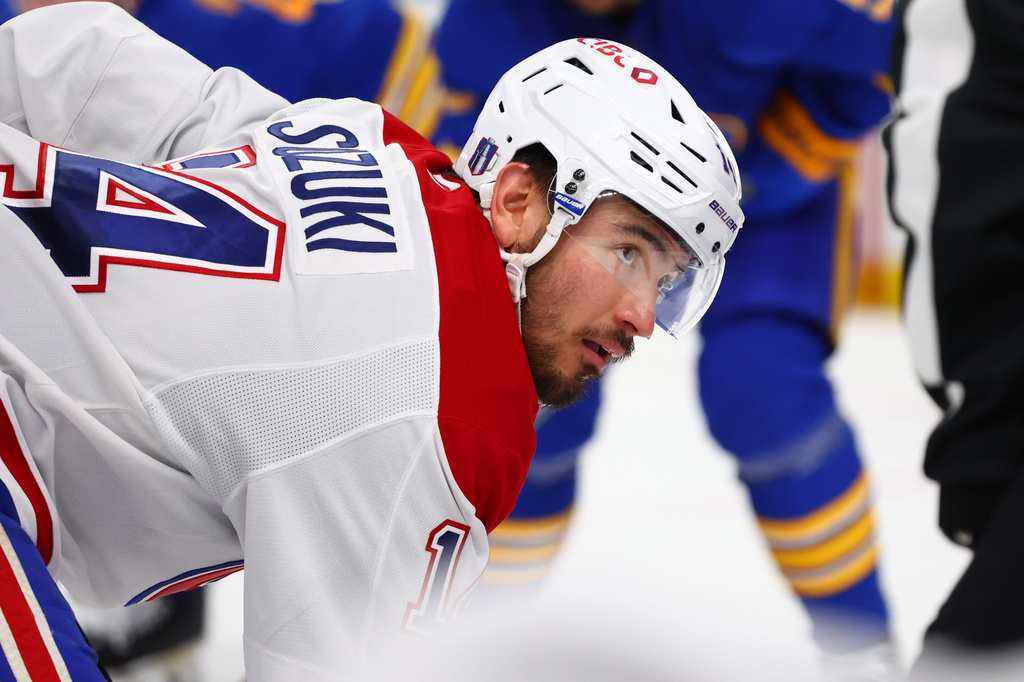 Montreal Canadiens center Nick Suzuki lines up for a face-off during the second period in Game 5 of a second-round NHL hockey Stanley Cup playoff series against the Buffalo Sabres, Thursday, May 14, 2026, in Buffalo, N.Y. (AP Photo/Jeffrey T. Barnes)