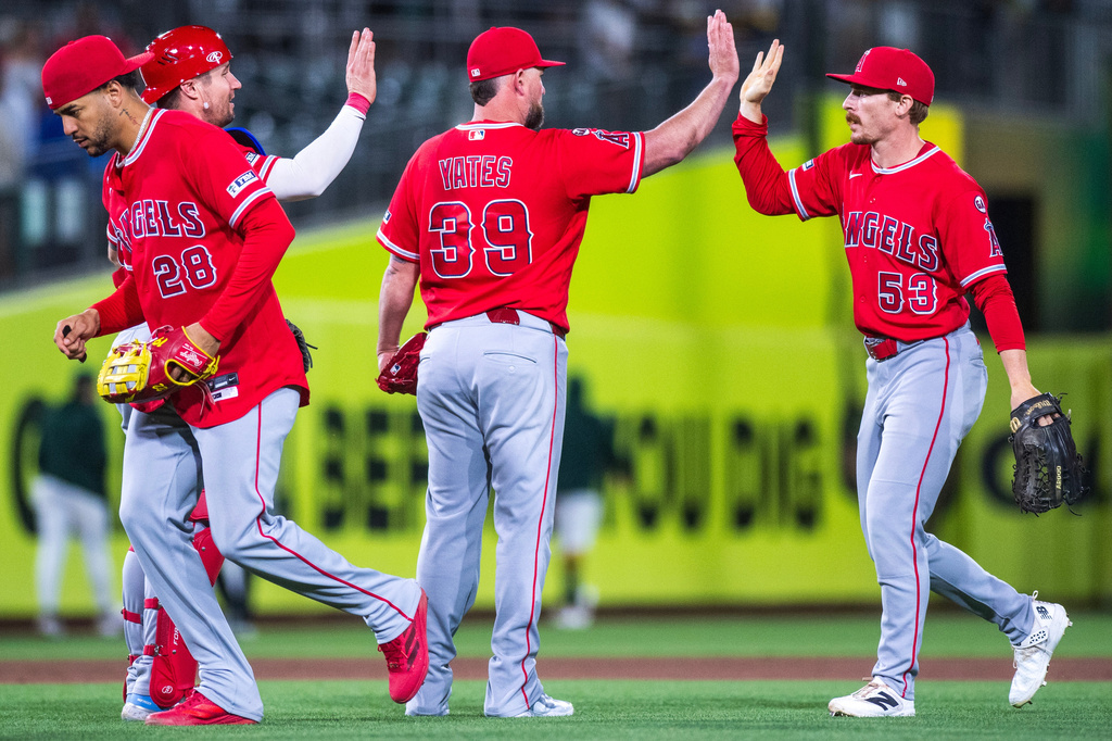 The Los Angeles Angels celebrate after winning a baseball game against the Athletics in West Sacramento, Calif., Saturday, June 20, 2026. (AP Photo/Nic Coury)
