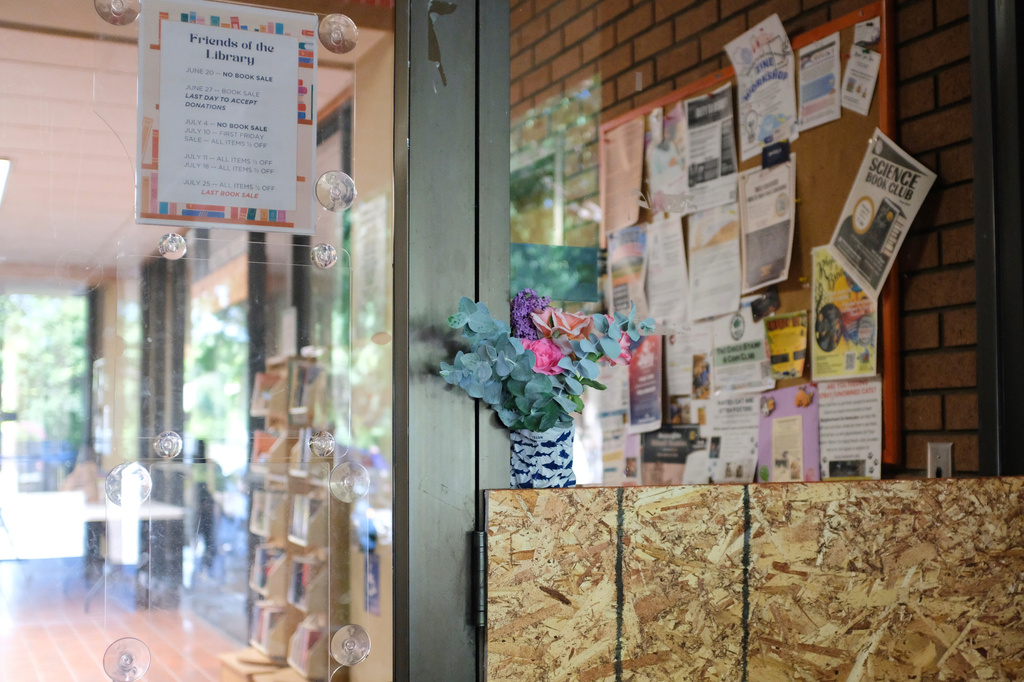 Flowers are placed outside the Chico branch of the Butte County Library a day after a shooting on Tuesday, June 23, 2026 in Chico, Calif. (Michael Weber/Chico Enterprise-Record via AP)