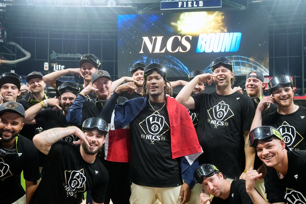 Milwaukee Brewers pitchers pose for a p[icture after Game 5 of baseball's National League Division Series against the Chicago Cubs Saturday, Oct. 11, 2025, in Milwaukee. (AP Photo/Morry Gash)