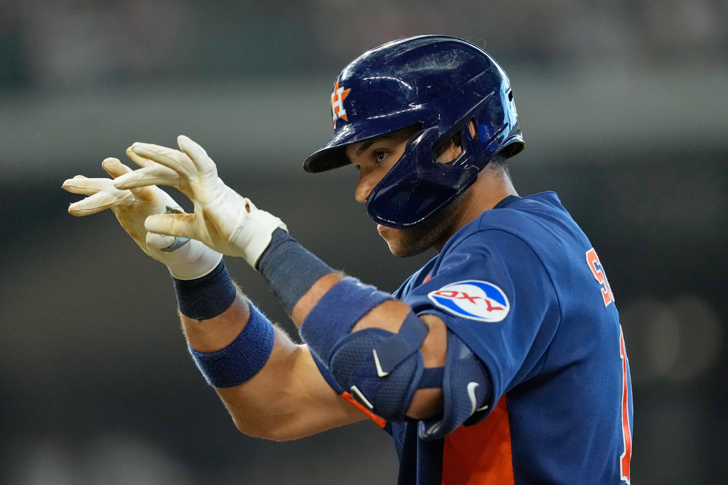 Houston Astros' Cam Smith celebrates after hitting a two-run single against the Texas Rangers during the seventh inning of a baseball game Sunday, Aug. 2, 2026, in Houston. (AP Photo/David J. Phillip)
