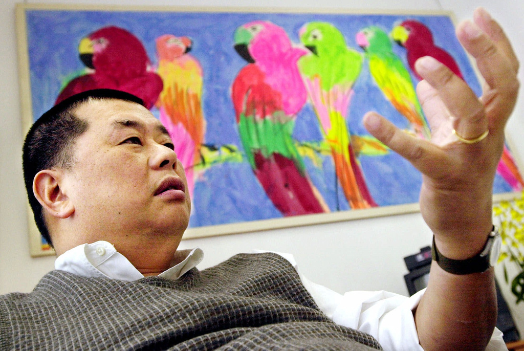 FILE - Hong Kong publisher Jimmy Lai speaks in his Hong Kong office at the Apple Daily newspaper, Nov. 28, 2000. (AP Photo/Vincent Yu, File)