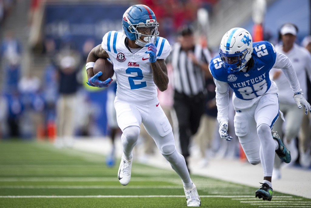 Mississippi Rebels wide receiver Harrison Wallace III (2) runs down the field as Kentucky Wildcats defensive back Jordan Lovett (25) closes in during the second quarter of an NCCA college football game in Lexington, Ky., Saturday, Sept. 6, 2025. (AP Photo/Tanner Pearson)