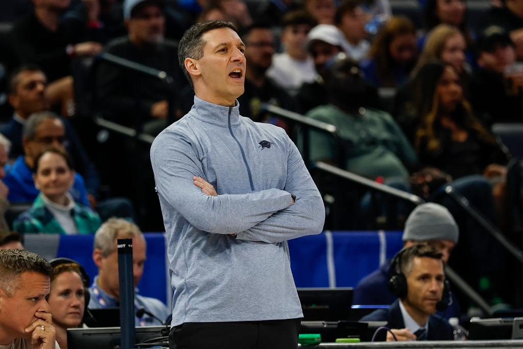 Oklahoma City Thunder head coach Mark Daigneault, calls out to his team as they play the Orlando Magic during the first half of an NBA basketball game Tuesday, March 17, 2026, in Orlando, Fla. (AP Photo/Kevin Kolczynski)