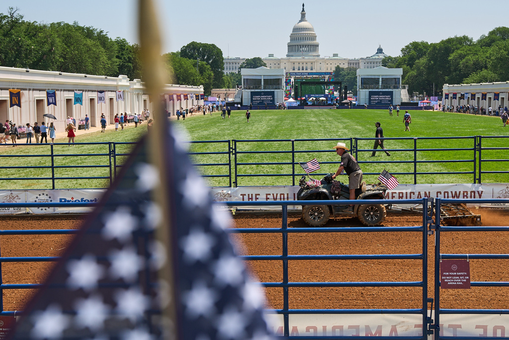 Tim Smith, with Veterans Equine Adventures, prepares the rodeo for tonight's performance at the Great State Fair on the National Mall, with the Capitol in the background, Wednesday, July 1, 2026, in Washington. (AP Photo/Jacquelyn Martin)