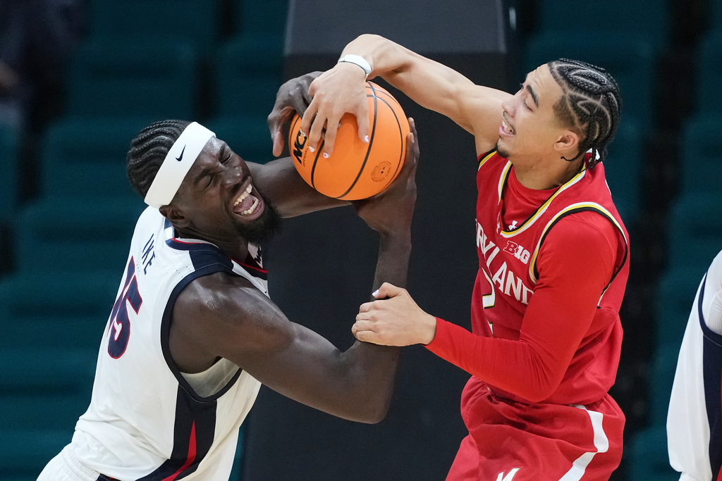 Gonzaga forward Graham Ike (15) and Maryland guard Myles Rice (2) fight for a rebound during the first half of an NCAA college basketball game in the Players Era tournament Las Vegas, Tuesday, Nov. 25, 2025. (AP Photo/Eric Gay)