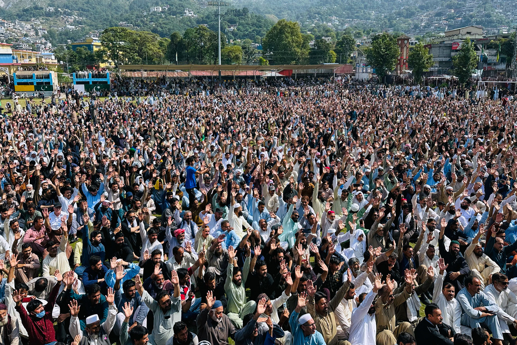 Members of Awami Action Committee chant slogans as they attend the funeral prayers of three victims, who were killed in Wednesday's clashes between police and protestors, in Muzaffarabad, the capital of Pakistani controlled Kashmir, Thursday, Oct. 2, 2025. (AP Photo/M.D. Mughal)