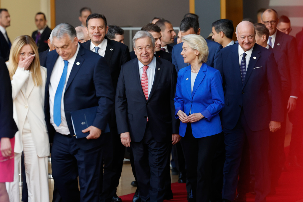 From left, Italy's Prime Minister Giorgia Meloni, Hungary's Prime Minister Viktor Orban, Portugal's Prime Minister Luis Montenegro, United Nations Secretary General Antonio Guterres, European Commission President Ursula von der Leyen and Austria's Chancellor Christian Stocker walk together prior to a group photo at an EU summit in Brussels, Thursday, March 19, 2026. (AP Photo/Geert Vanden Wijngaert)