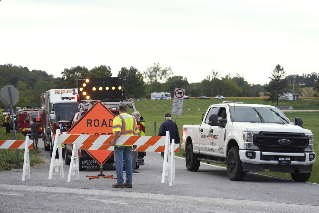 Emergency personnel block a road after a shooting involving police officers on Wednesday, Sept. 17, 2025, in North Codorus, Pa. (AP Photo/Matt Slocum)