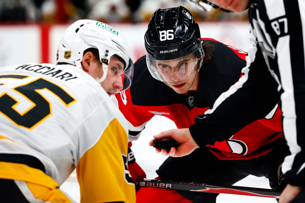 FILE - New Jersey Devils center Jack Hughes (86) before a face off against Pittsburgh Penguins center Noel Acciari (55) during the second period of an NHL hockey game, April 9, 2026, in Newark, N.J. (AP Photo/Noah K. Murray, File)