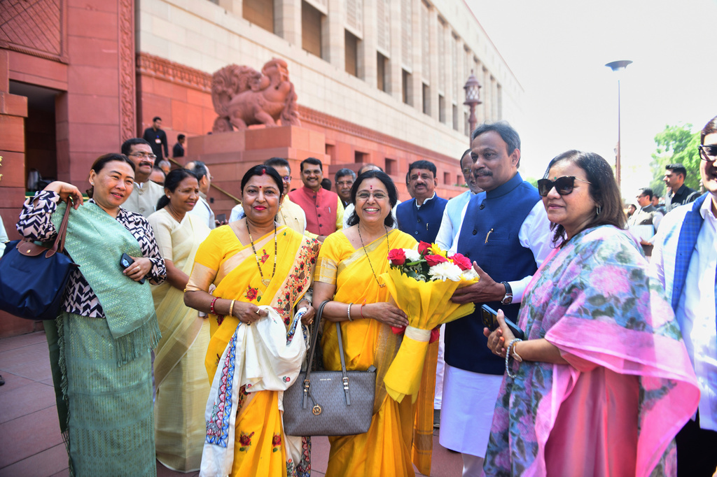 Indian women lawmakers pose outside Parliament House before the start of the debate on a landmark bill to reserve one-third of seats for women, in New Delhi, India, Thursday, April 16, 2026. (AP Photo)