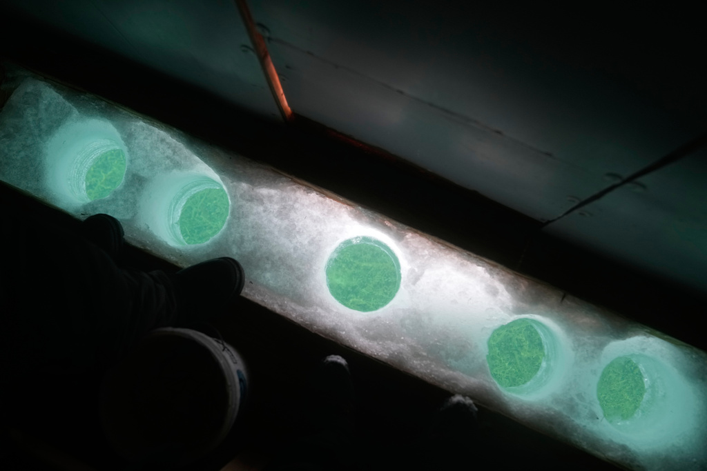 Holes for ice fishing are made on the frozen Lake Simcoe in the Innisfil area north of Toronto, Wednesday, Jan. 7, 2026. (AP Photo/Kamran Jebreili)