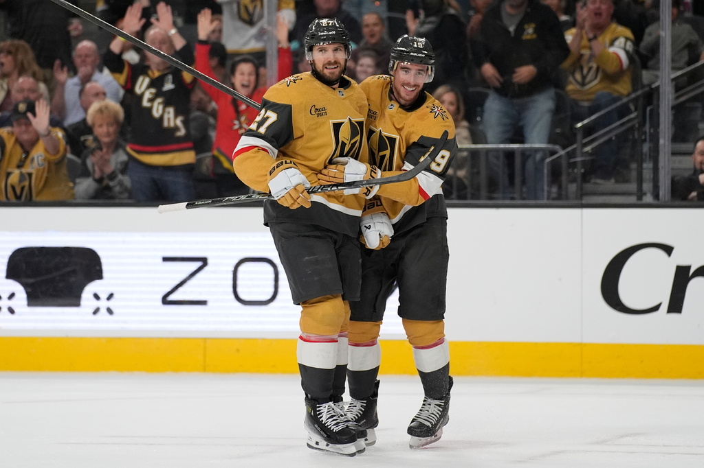 Vegas Golden Knights defenseman Shea Theodore (27) celebrates after scoring against the Seattle Kraken during the second period of an NHL hockey game Wednesday, April 15, 2026, in Las Vegas. (AP Photo/John Locher)