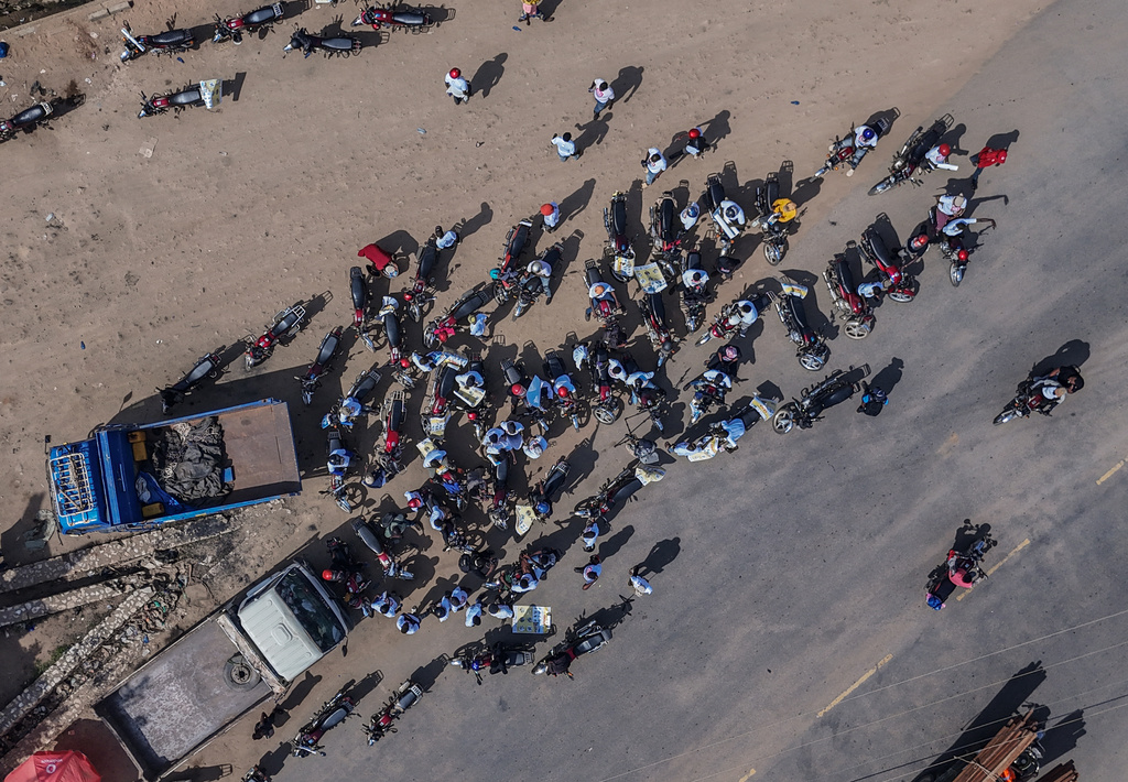 A drone view of motorcyclists as they join an awareness campaign organized by the World Health Organization (WHO) to combat Ebola in Bunia, Congo, Wednesday, June 10, 2026. (AP Photo/Moses Sawasawa)