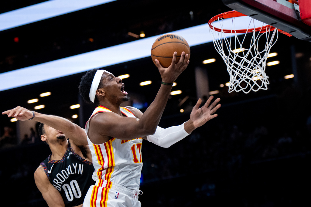 Atlanta Hawks forward Onyeka Okongwu (17) scores during the first half of an NBA basketball game against the Brooklyn Nets, Friday, April 3, 2026, in New York. (AP Photo/Angelina Katsanis)