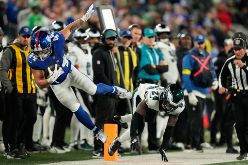 New York Giants' Cam Skattebo, left, is hit by Philadelphia Eagles' Andrew Mukuba during the second half of an NFL football game Thursday, Oct. 9, 2025, in East Rutherford, N.J. (AP Photo/Yuki Iwamura) New York Giants' Cam Skattebo, left, is hit by Philadelphia Eagles' Andrew Mukuba during the second half of an NFL football game Thursday, Oct. 9, 2025, in East Rutherford, N.J. (AP Photo/Yuki Iwamura)
